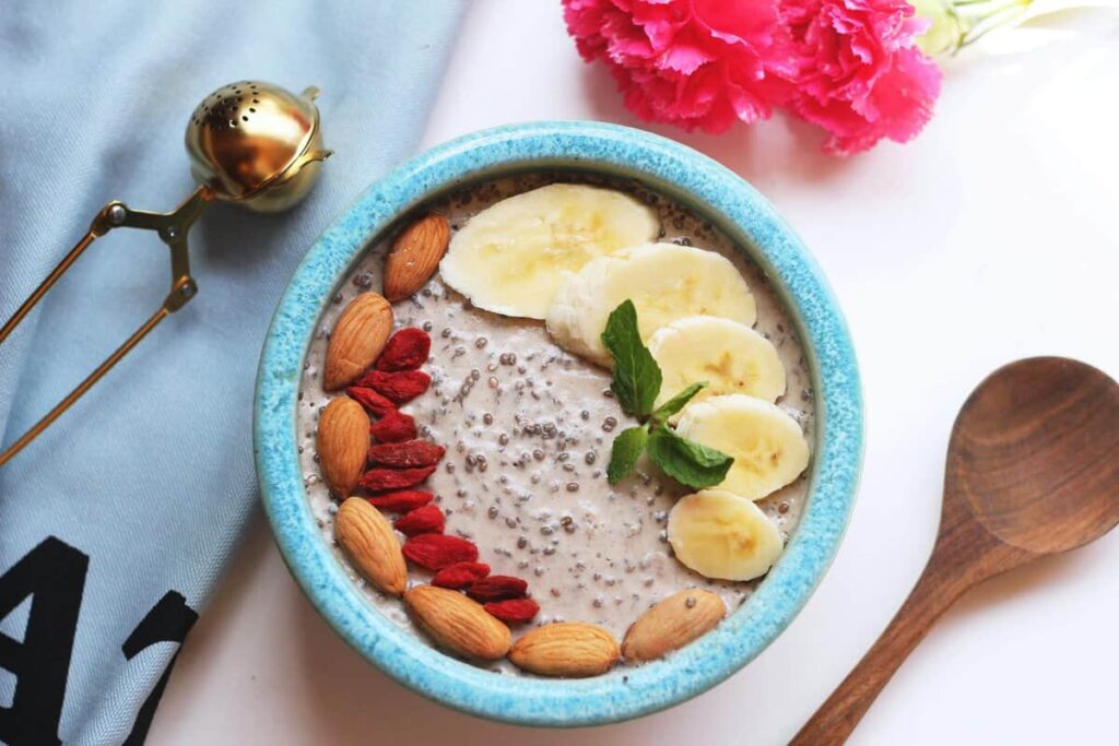 smoothie bowl topped with chia seeds and fresh fruits