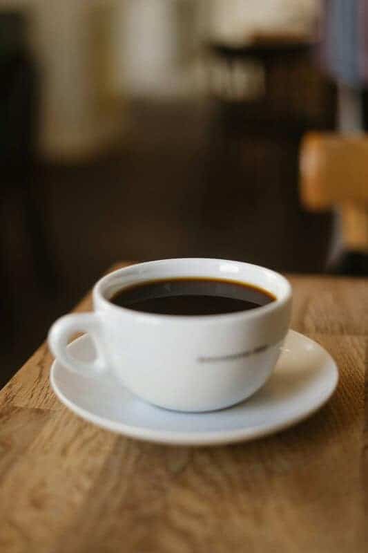 Black coffee in cup used for weight loss and morning energy boost